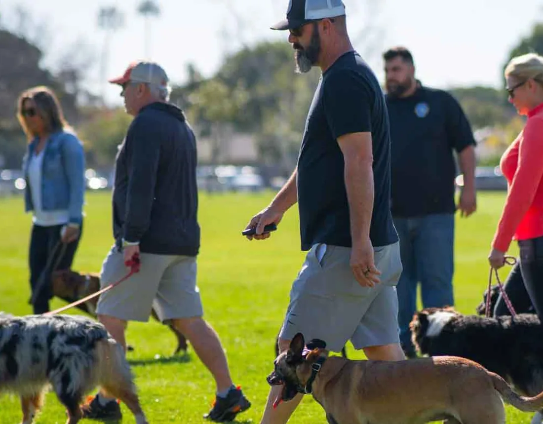 Epic Dog Academy trainers running a group class with owners and their dogs